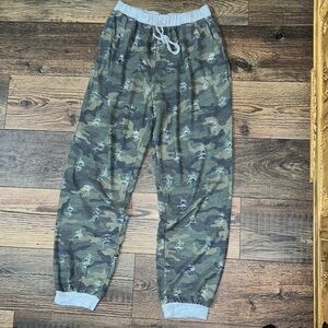Camo distressed joggers. Grey trim. Elastic waist with string for looks.